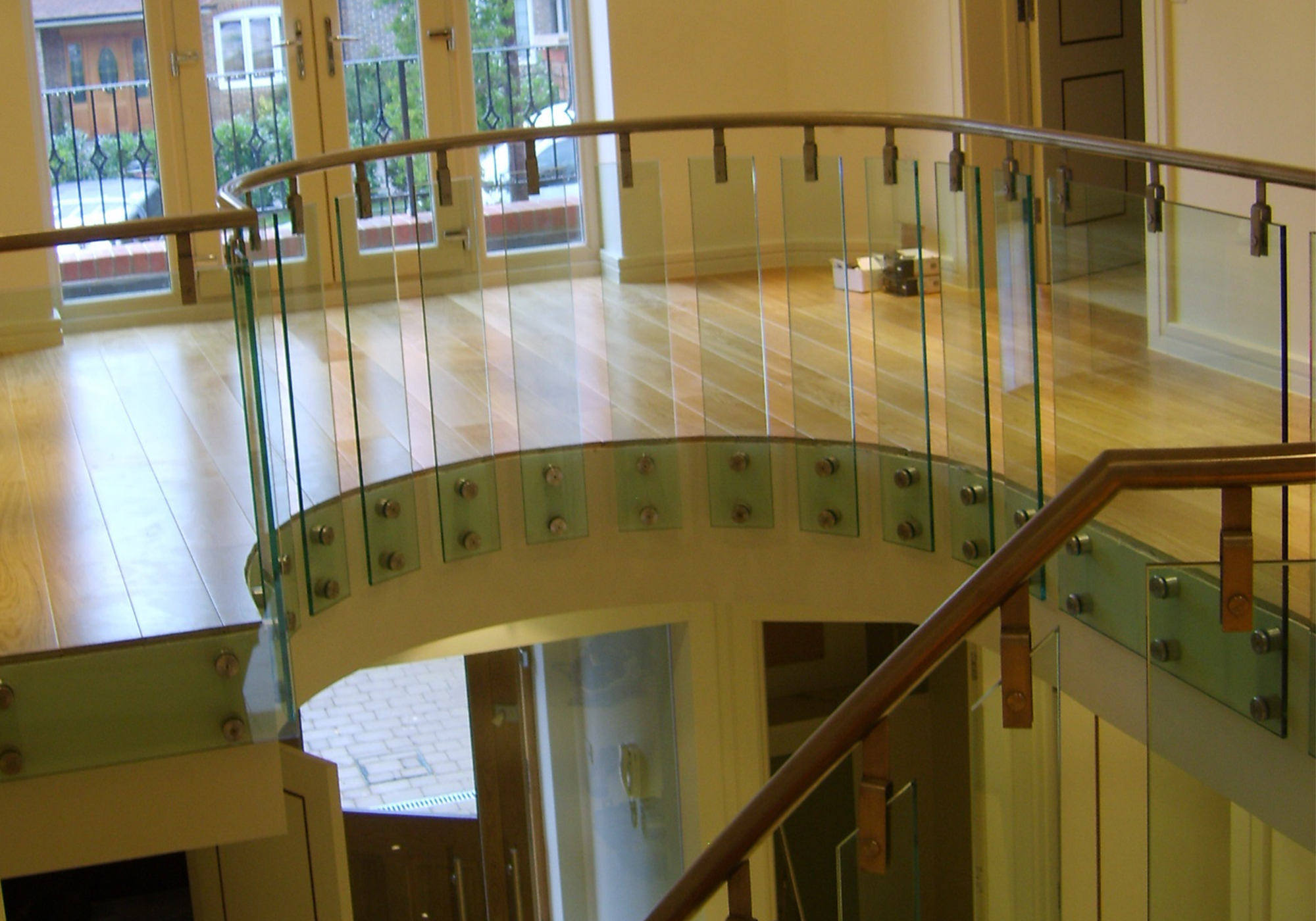 winding staircase and landing in oak and glass